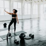 a woman is doing exercises in a gym