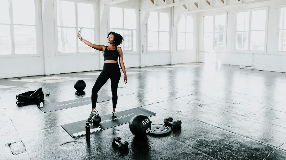 a woman is doing exercises in a gym